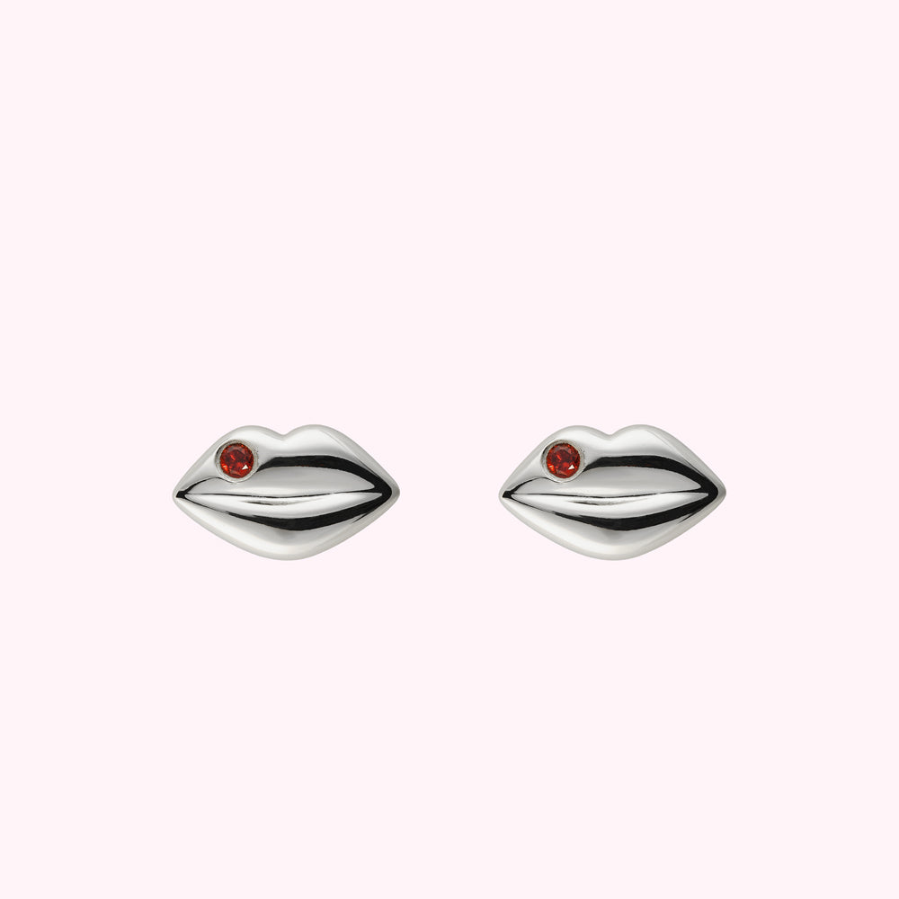 Sterling silver lip shaped stud earring with inset Ruby precious stones.