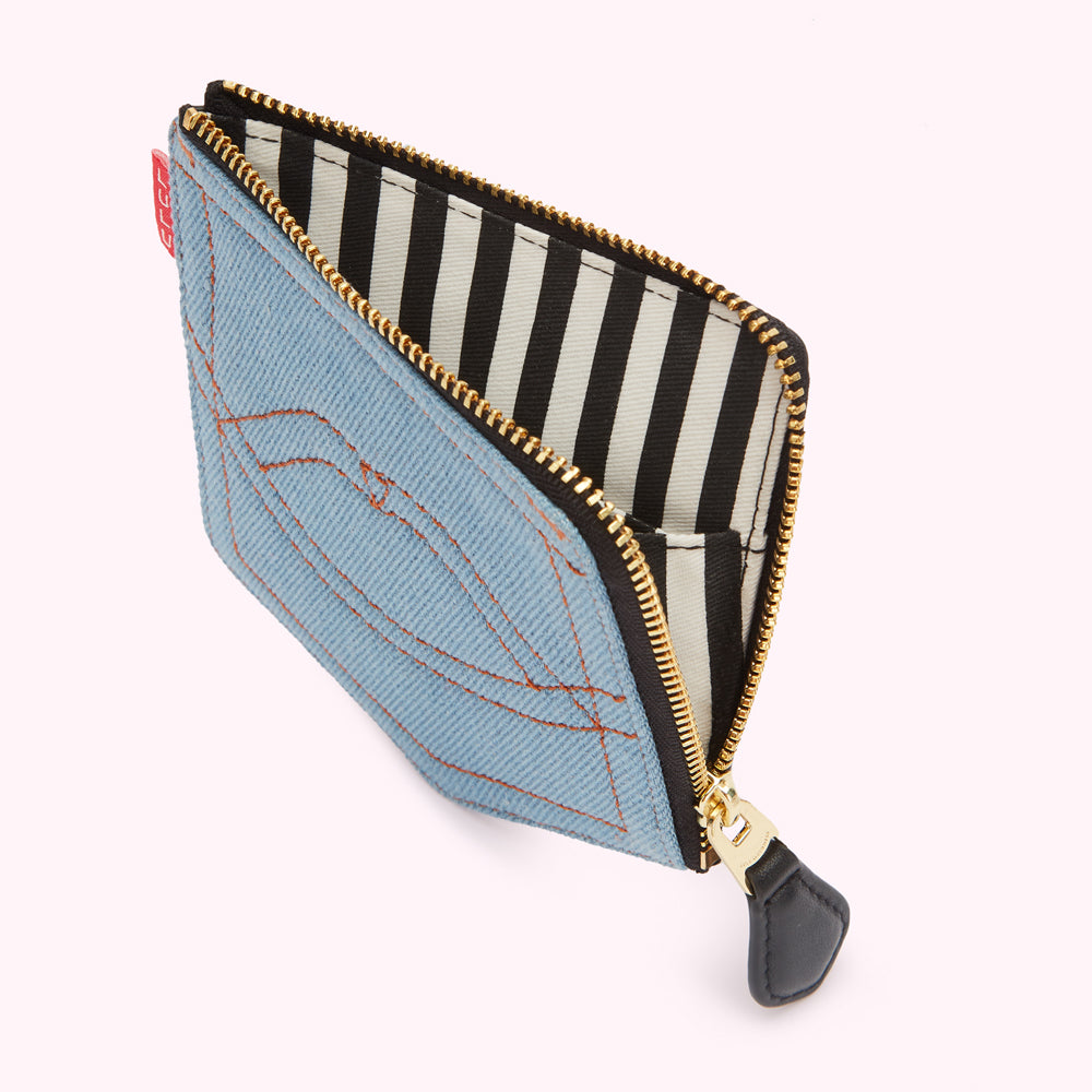 Light blue denim zipper pouch with black and white striped lining.