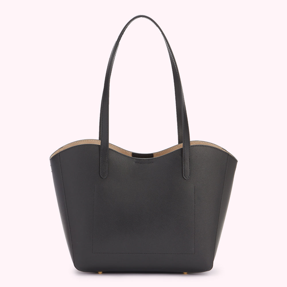 Back image of a black leather tote bag with a curved back edge.