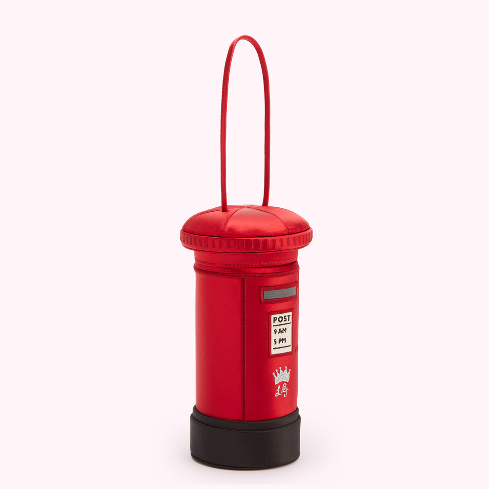 Red satin postbox-shaped handbag with black base and top, hanging loop, and small crown emblem.