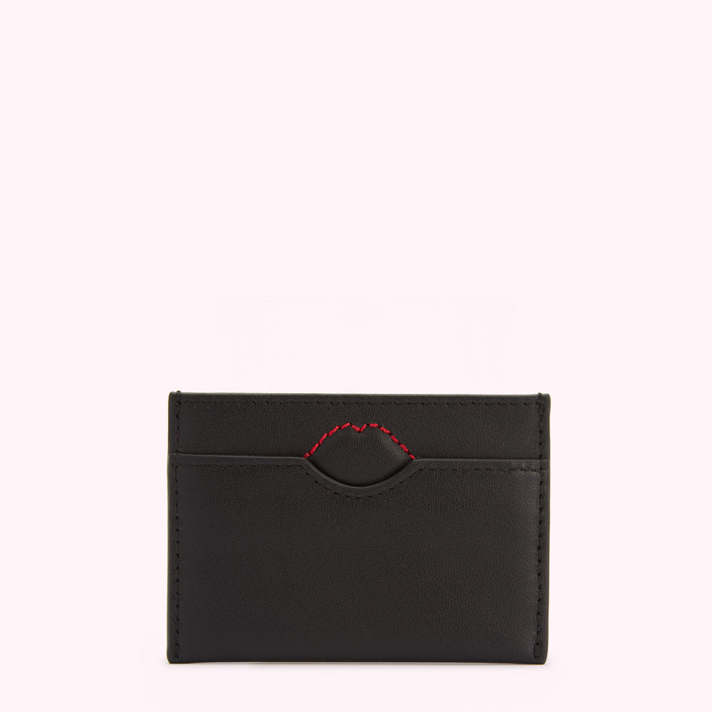 Black leather cardholder with a red lip-shaped detail.
