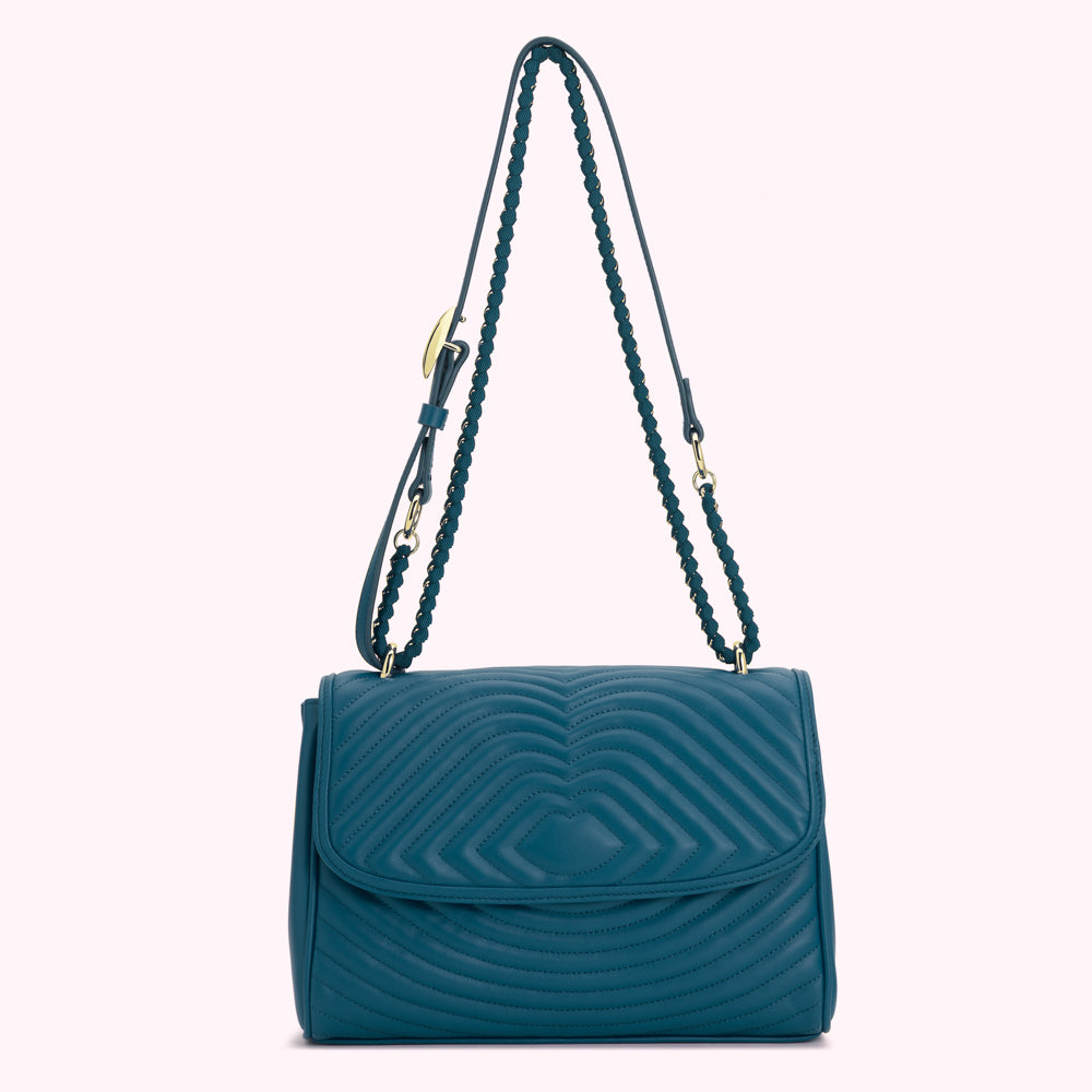 Teal quilted shoulder bag with gold chain strap.
