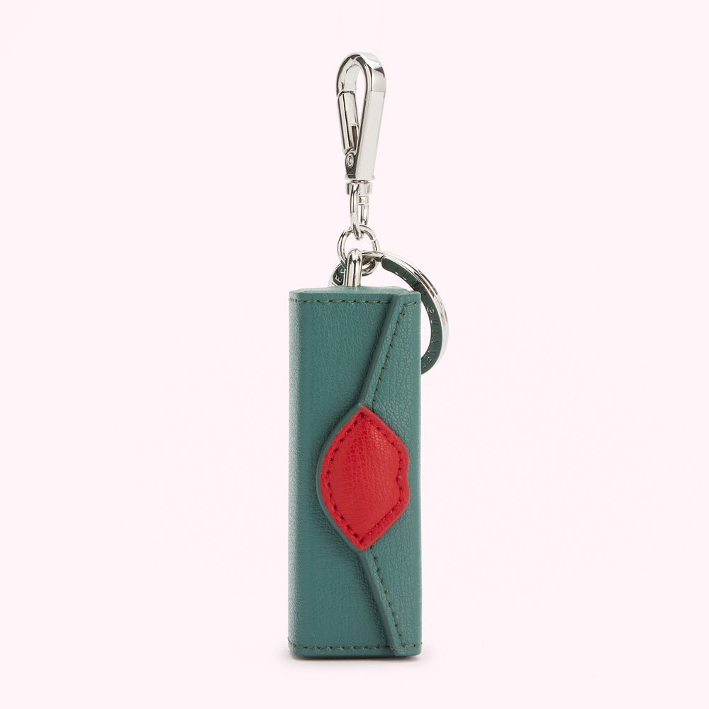 Teal leather keychain with a red accent.
