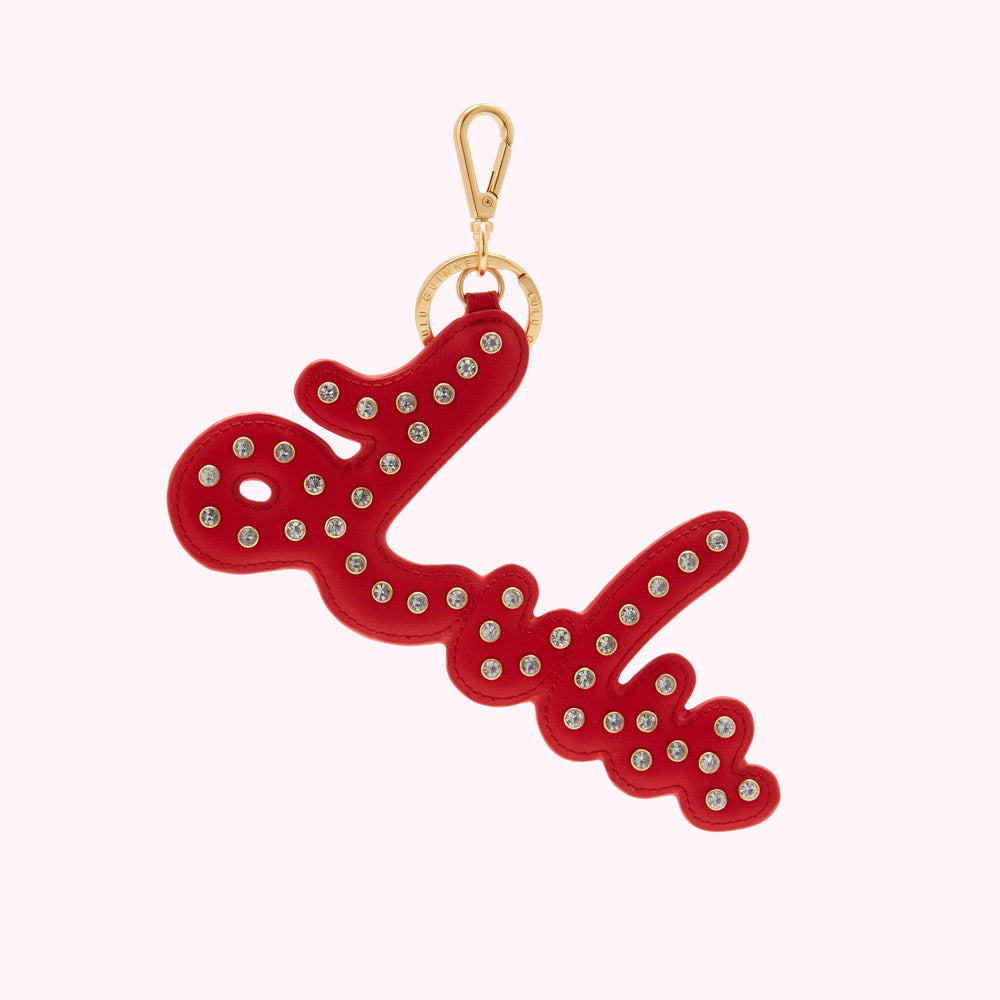 Red leather Love keychain with crystal embellishments and gold-tone hardware.
