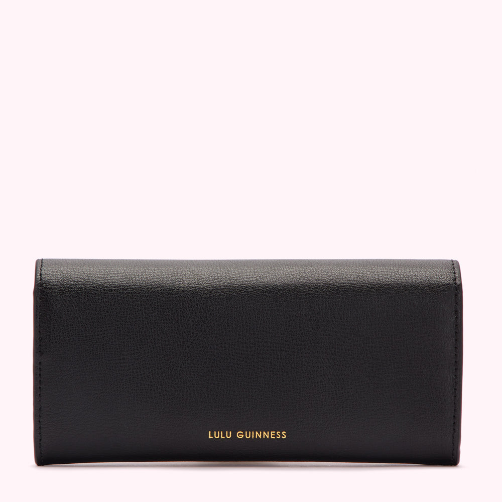 Black Lulu Guinness wallet on white background.
