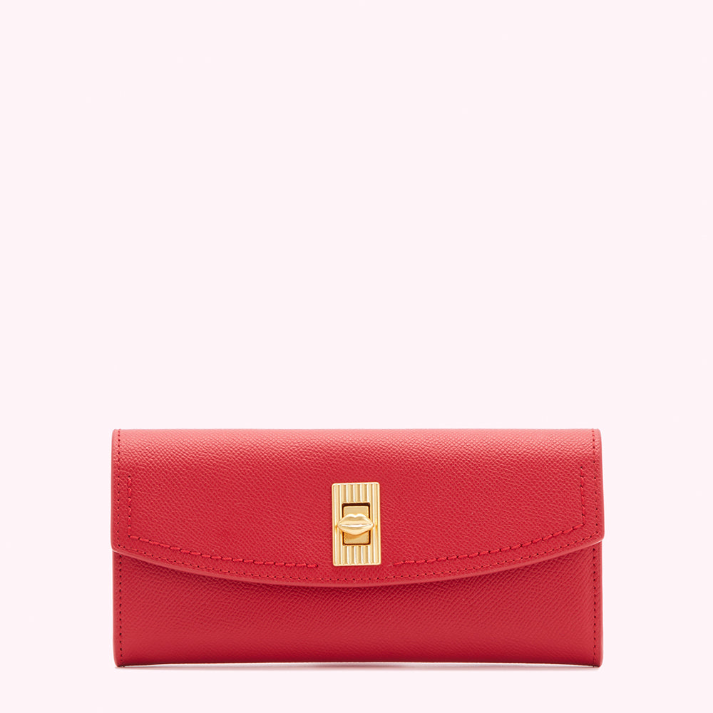 Red leather wallet with gold clasp.
